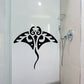 Black stylized stingray decal with ornate swirling details