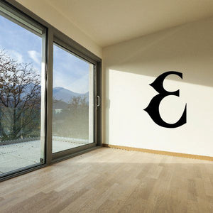 Vinyl wall decal with black stylized C symbol