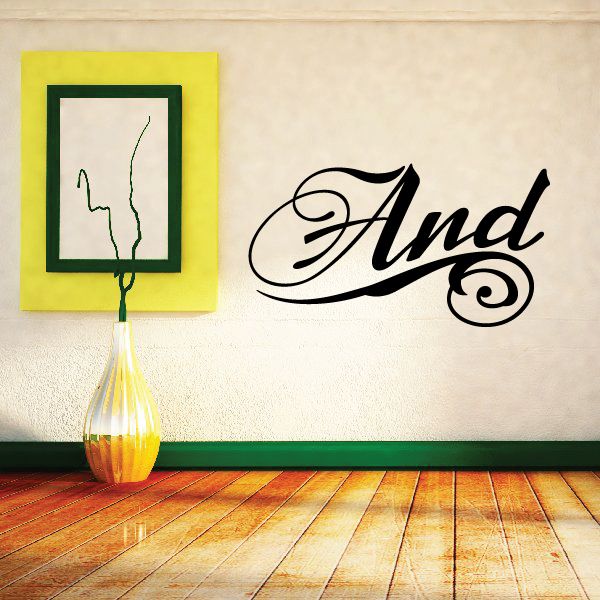 Cursive "And" wall vinyl decal in black