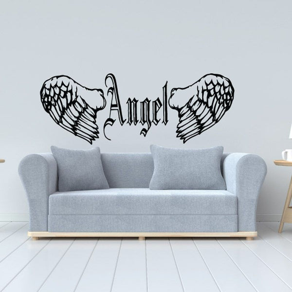 Angel wings and text decal with dark outlined lettering on light background