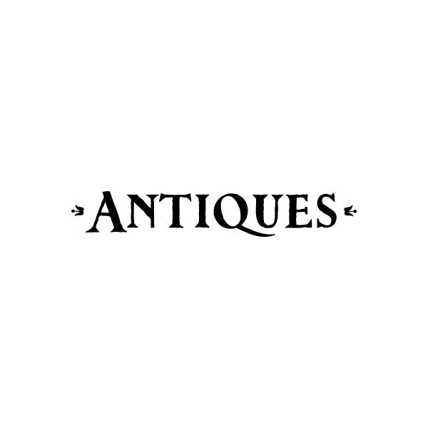 Antiques vinyl decal with bold black lettering and small ornamental flourishes