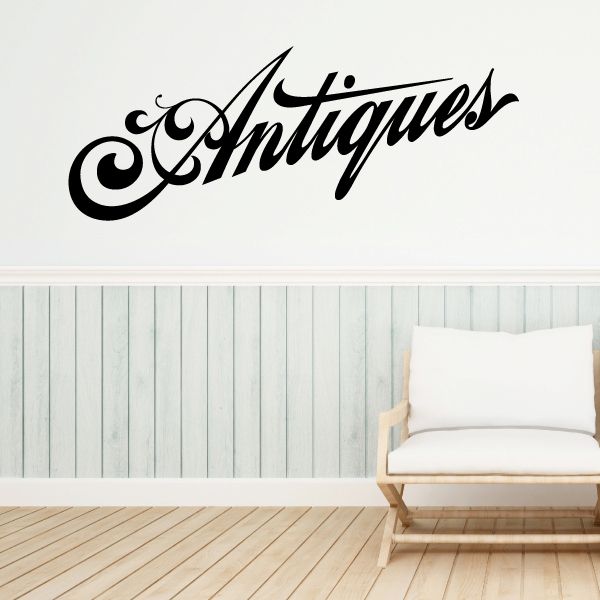 Antiques vinyl wall decal in black cursive lettering