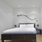 Wall decal with cursive quote: “Anything is possible when it comes to love”