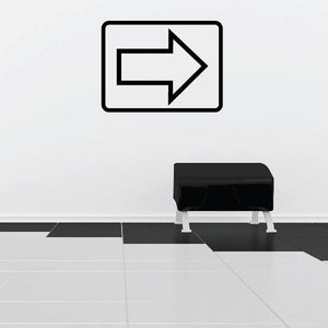 Right-pointing arrow wall decal in black outline with white fill inside rounded rectangle