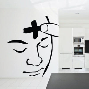Ash Wednesday decal with black stylized face in profile and a cross