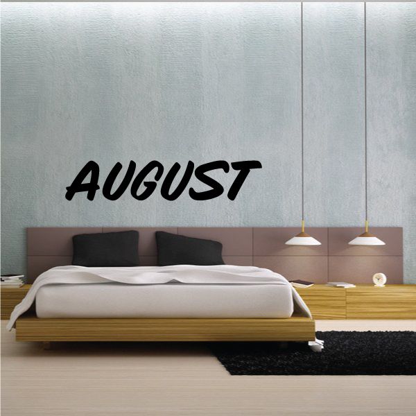 Wall vinyl decal with bold black “AUGUST” lettering