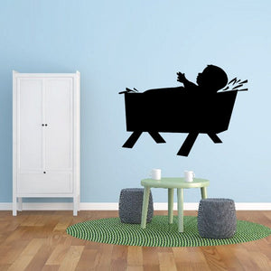 Black baby Jesus silhouette decal on manger, wall-ready decoration