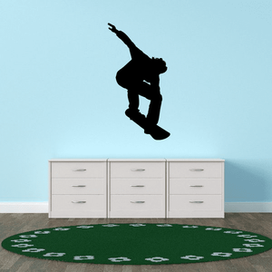 Snowboarding decal sticker with black backside board-grab silhouette, mid-jump