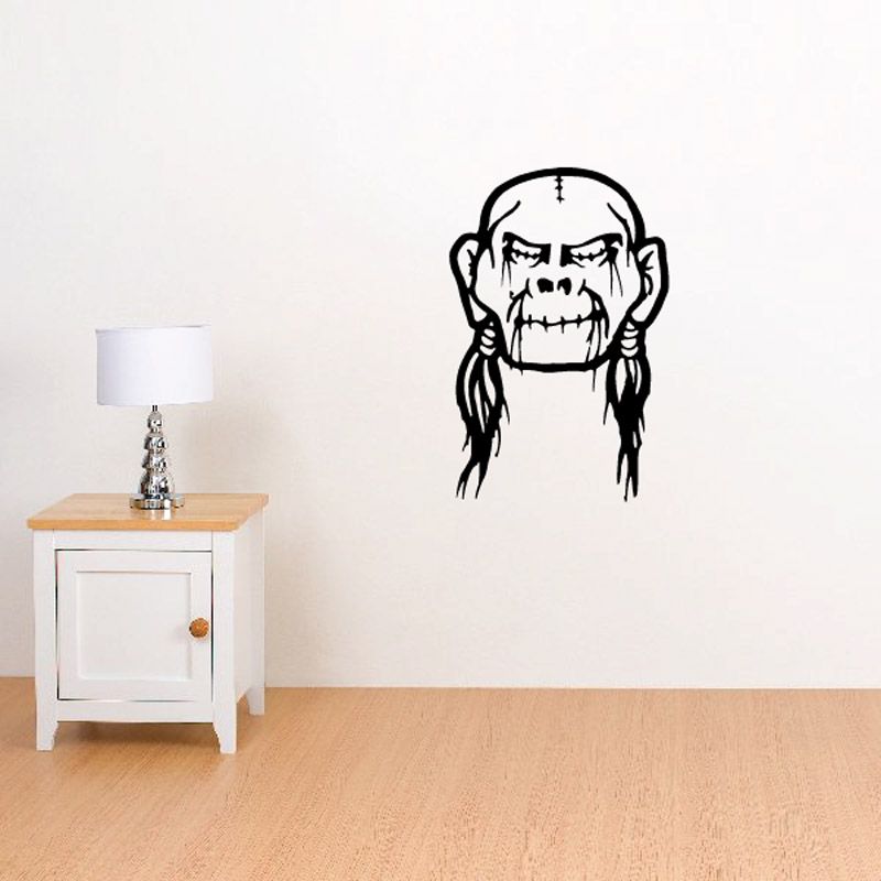 Bald shrunken head decal, black skull face with long braided hair