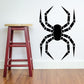 Black ball-jointed spider decal with segmented legs and body.