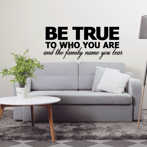 Wall decal with 'BE TRUE TO WHO YOU ARE' and cursive 'family name you bear'