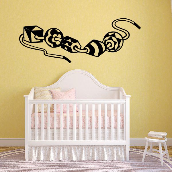 Black vinyl wall decal with scrolling tribal-style pattern