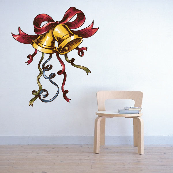 Golden bells sticker with red bow and curling ribbon swirls