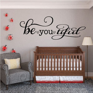 Cursive wall decal reading 'be you tiful' with heart accents