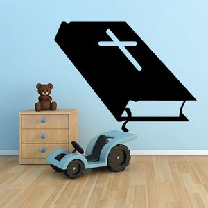 Black graduation-cap decal with light blue cross symbol and book icon