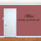 Wall decal with cursive text: Bless this home and all who enter