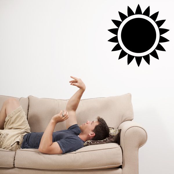 Sunburst wall decal with black center circle and white spiky rays