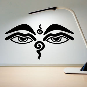 Black Buddha eye wall decal with symmetrical eyes and central swirl motif