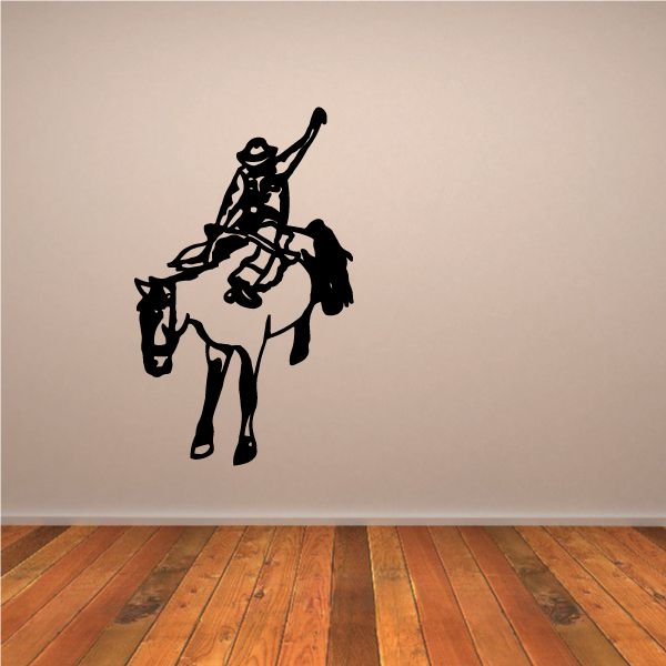 Bull riding wall decal: black vinyl silhouette of a rider on a bull