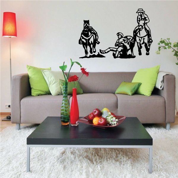 Vinyl wall decal of a cowboy on a bucking bull, black silhouette