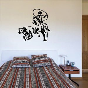Bull riding vinyl wall decal with black bull rider silhouette and bull at center