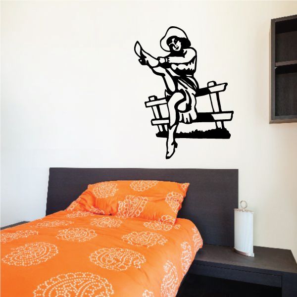 Bull riding wall decal, black silhouette of rider on bull with hat and raised hand