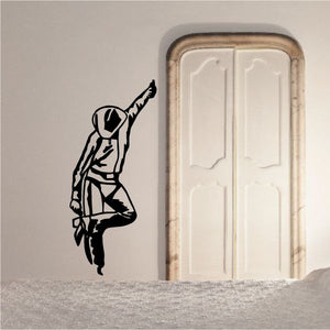 Bull riding wall decal: black cowboy bull rider silhouette with raised arm.