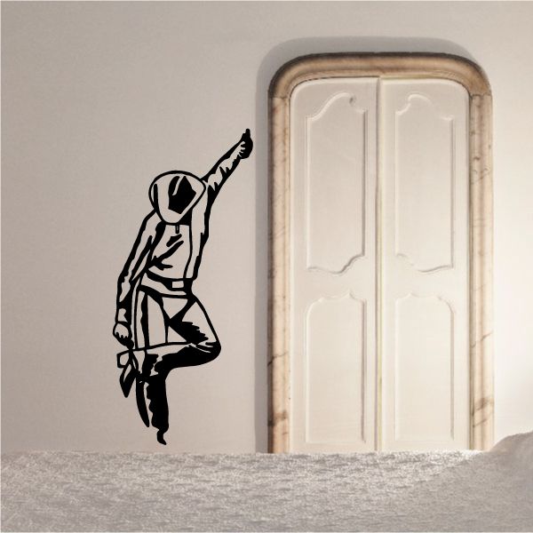 Bull riding wall decal: black cowboy bull rider silhouette with raised arm.