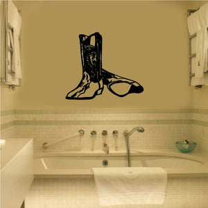 Black bull riding wall decal showing a cowboy boot and bull silhouette
