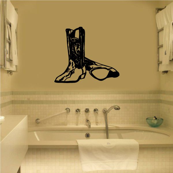 Black bull riding wall decal showing a cowboy boot and bull silhouette