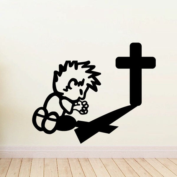 Calvin praying decal: black angel figure kneeling with large cross