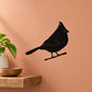 Perched bird decal featuring a black bird silhouette sitting on a small branch perch