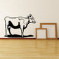 Cartoon cow head wall decal with black-and-white outline and spots