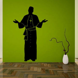 Catholic priest wall decal with black robe and open hands, gold cross on back
