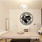 Heart-themed wall decal with black cat paw print and text in a circle.