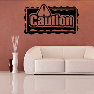 Caution wall decal with warning triangle and bold “Caution” text