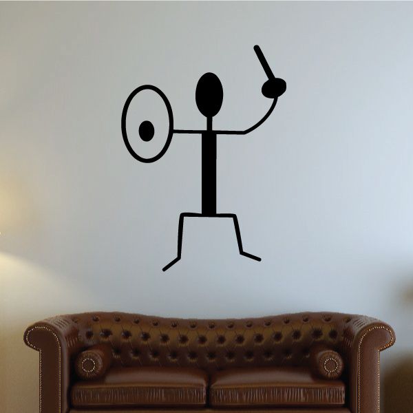 Black warrior wall decal with raised arm and spear-like staff