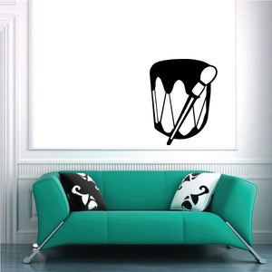 Ceremonial drum decal with black drum and white mallets, circular design