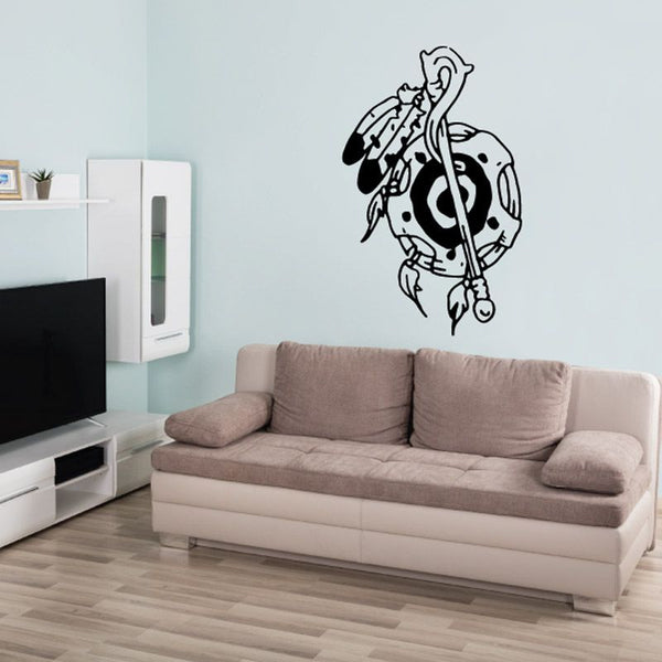 Black line-art wall decal of a musician holding a staff-like instrument