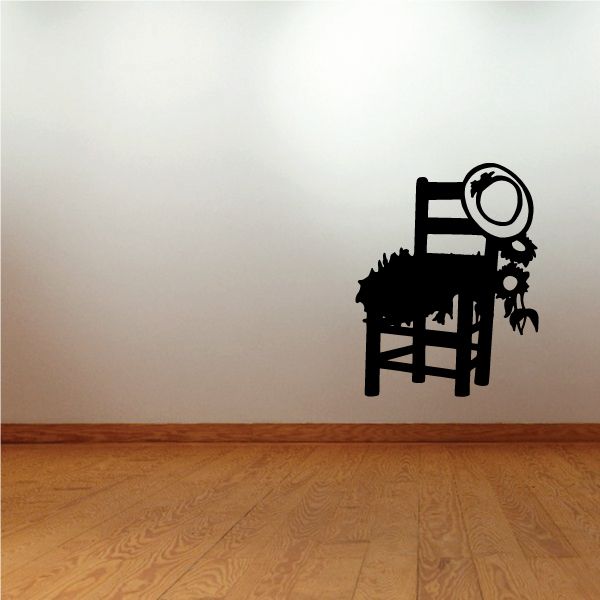 Black vinyl wall decal of a chair with circular speaker-like element and small figures