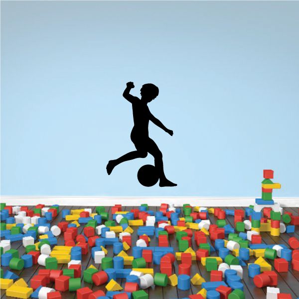 Black vinyl child soccer player dribbling decal silhouette, soccer ball at feet