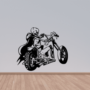 Black vinyl wall decal of a cartoon rider on a motorcycle