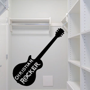 Black guitar-shaped decal with white text reading “CHRISTIAN ROCKER”