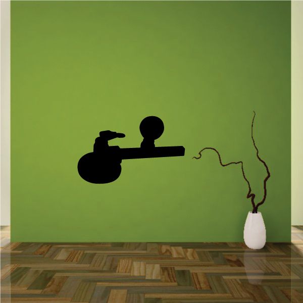 Black vinyl wall decal with silhouette of a cutting tool
