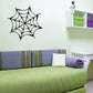 Black spider web wall decal with eight radiating spokes and circular web pattern