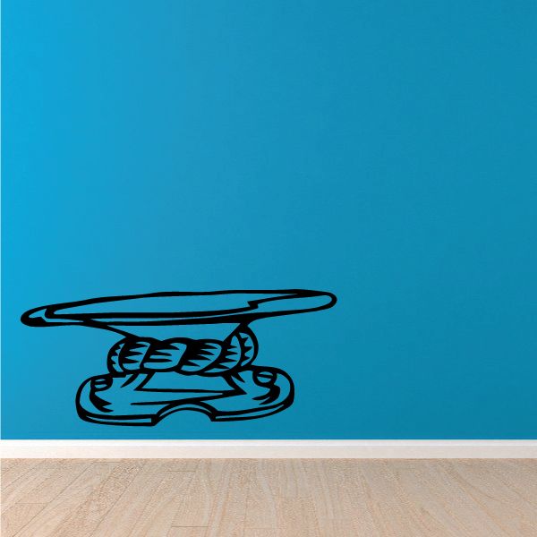 Black vinyl wall decal of a stylized sports cleat
