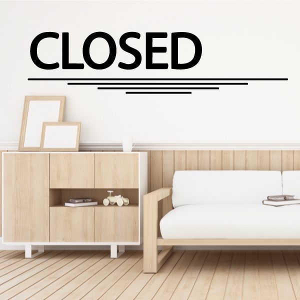Black wall decal reading CLOSED with underline and three short lines