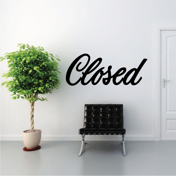 Black "Closed" script vinyl wall decal for business signage