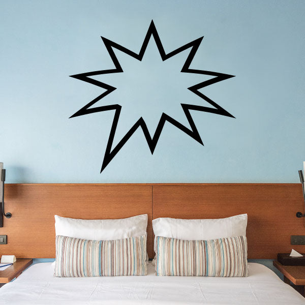 Spiky comic burst outline decal, black starburst shape on a light wall