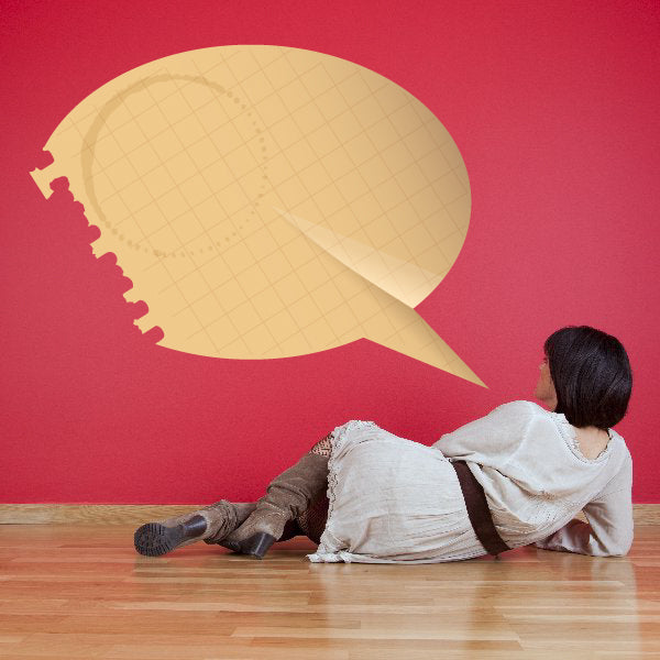Beige torn-edge speech bubble sticker with subtle grid pattern